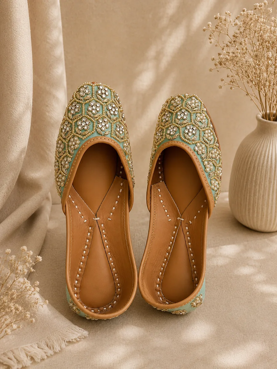 Jade Noor juttis in soft green with a lattice of pearl, bead and rhinestone detail.