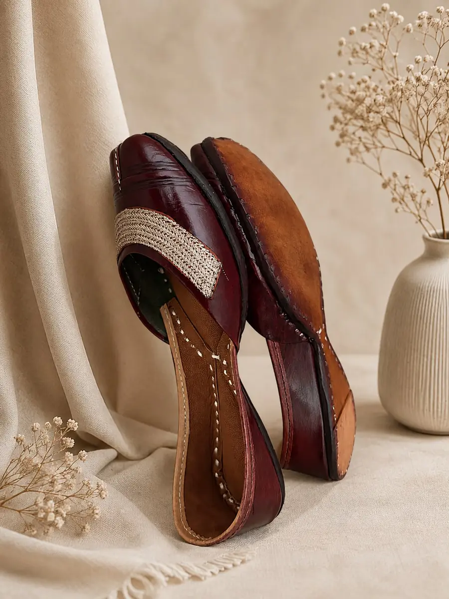 Mocha Grace jutti resting against its pair, showing the stitched leather sole.